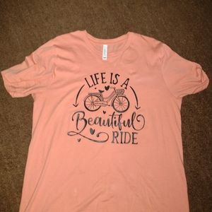 "Life is a Beautiful Ride" shirt in a coral pink and a size large